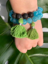 Load image into Gallery viewer, Aquamarine Healing Crystal Lava Beads &amp; Green Tassel Bracelet
